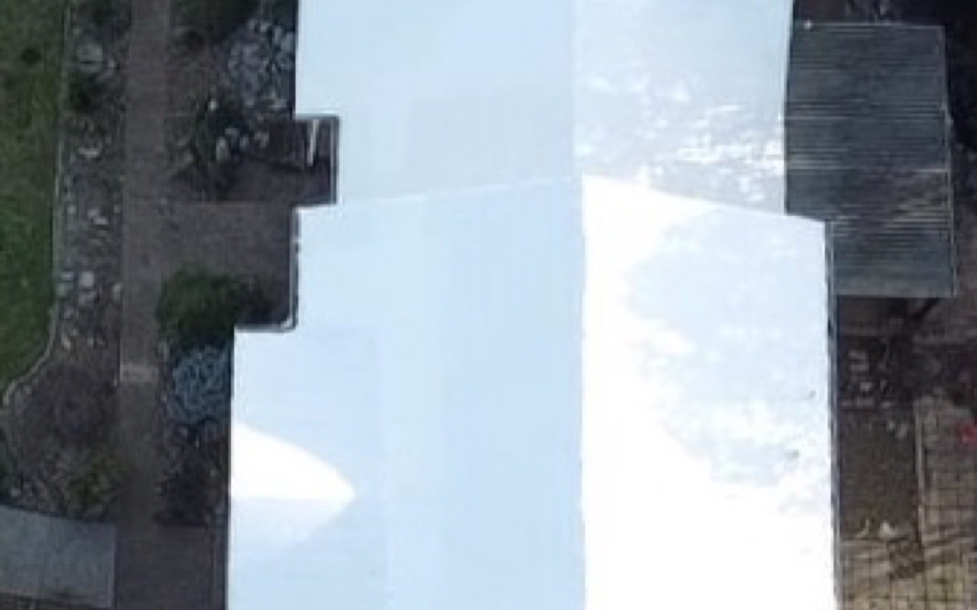The same roof sealed watertight under a continuous white RoofWrap membrane