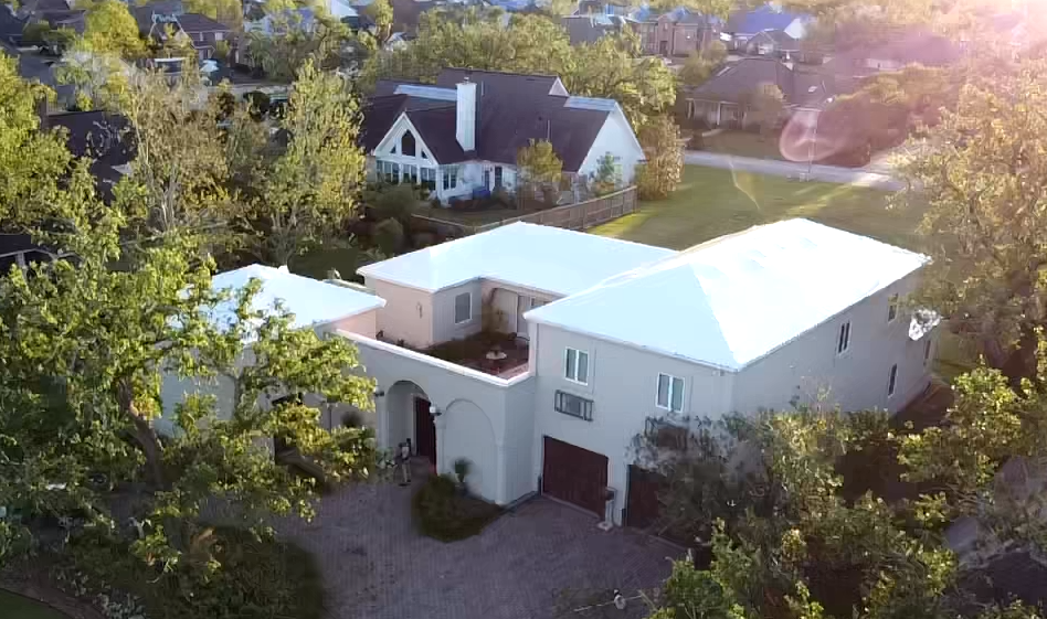 The same tile roof home sealed under white RoofWrap