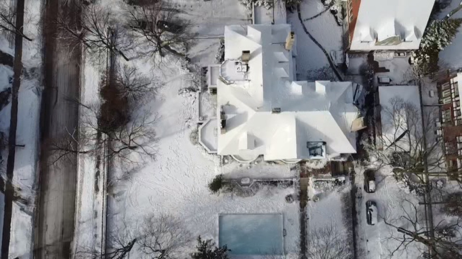 Home roof sealed under RoofWrap and covered in snow during a winter storm